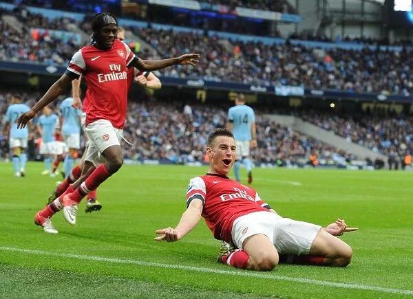 Koscielny and Gervinho Celebrate Arsenal's Goal Against Manchester City (2012-13)