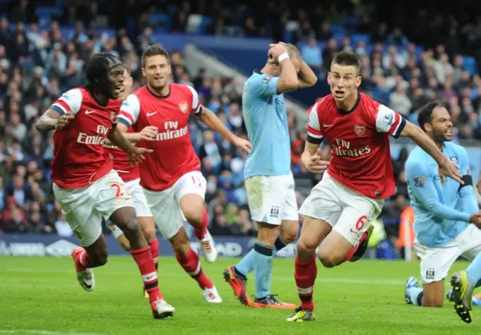 Framed Print : Koscielny, Giroud, Gervinho: Arsenal's Goal Celebration Against Manchester City (2012-13) Framed Print : Koscielny, Giroud, Gervinho: Arsenal's Goal Celebration Against Manchester City (2012-13)