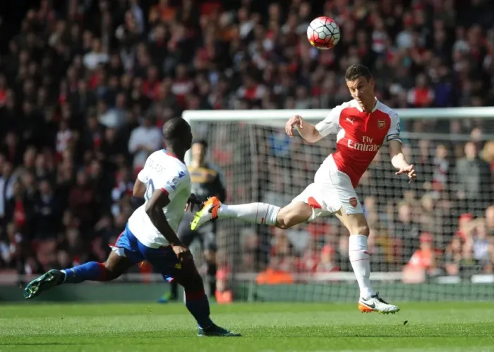Framed Print : Koscielny Stands Firm: Arsenal Star Fends Off Bolasie Threat in Intense Premier League Showdown