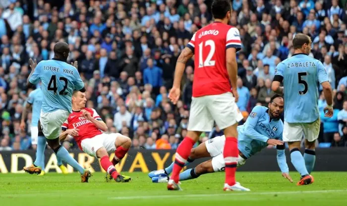 Framed Print : Koscielny Strike: Manchester City vs. Arsenal - Premier League's 1-1 Thriller at Etihad Stadium