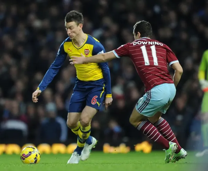 Framed Print : Koscielny Surges Past Downing: West Ham vs. Arsenal, Premier League 2014-15 Framed Print : Koscielny Surges Past Downing: West Ham vs. Arsenal, Premier League 2014-15