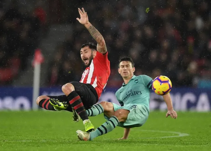 Framed Print : Koscielny vs. Austin: A Premier League Battle - Arsenal's Laurent Koscielny Clashes with Southampton's Charlie Austin (December 2018) Framed Print : Koscielny vs. Austin: A Premier League Battle - Arsenal's Laurent Koscielny Clashes with Southampton's Charlie Austin (December 2018)