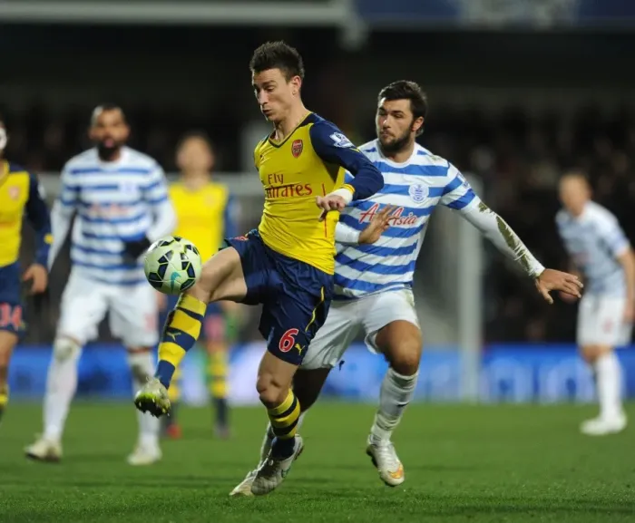 Framed Print : Koscielny vs. Austin: A Premier League Battle at Loftus Road Framed Print : Koscielny vs. Austin: A Premier League Battle at Loftus Road