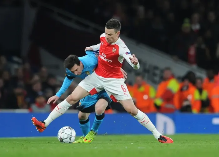 Framed Print : Koscielny vs. Messi: A Champions League Battle at Arsenal