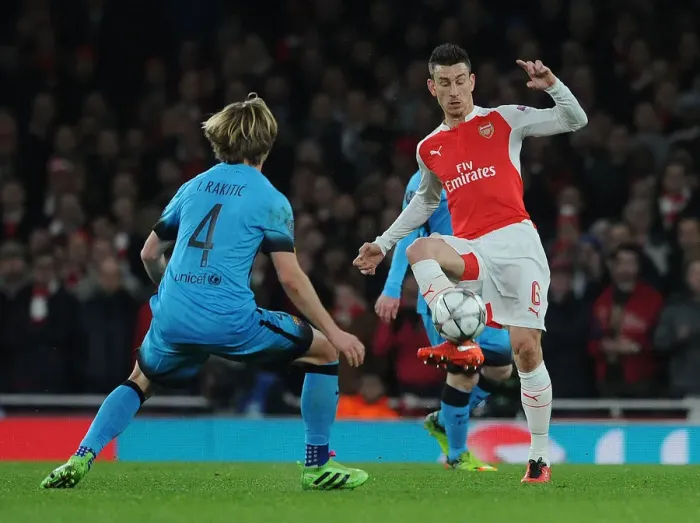 Framed Print : Koscielny vs. Rakitic: A Champions League Battle at the Emirates Framed Print : Koscielny vs. Rakitic: A Champions League Battle at the Emirates