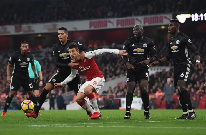 Framed Print : Koscielny vs Smalling: A Battle for Supremacy - Arsenal vs Manchester United