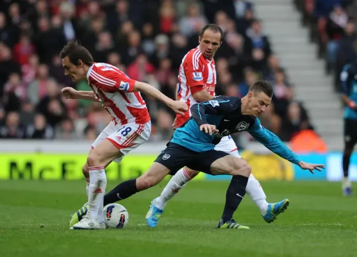Framed Print : Koscielny vs. Whitehead: Intense Battle in Stoke City vs. Arsenal (2011-12)