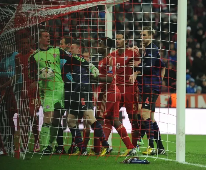 Framed Print : Koscielny's Battle with Neuer: Arsenal vs. Bayern Munich in the UEFA Champions League