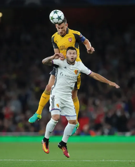 Framed Print : Koscielny's Defiant Header: Arsenal vs. Basel in Champions League Showdown Framed Print : Koscielny's Defiant Header: Arsenal vs. Basel in Champions League Showdown
