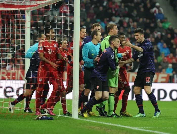 Framed Print : Koscielny's Determined Clash with Neuer: Bayern Munich vs. Arsenal, UEFA Champions League 2012-13 Framed Print : Koscielny's Determined Clash with Neuer: Bayern Munich vs. Arsenal, UEFA Champions League 2012-13