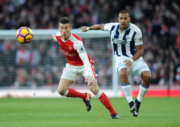 Framed Print : Koscielny's Determined Defence: Arsenal vs. West Bromwich Albion (2016-17) - Koscielny Fends Off Rondon