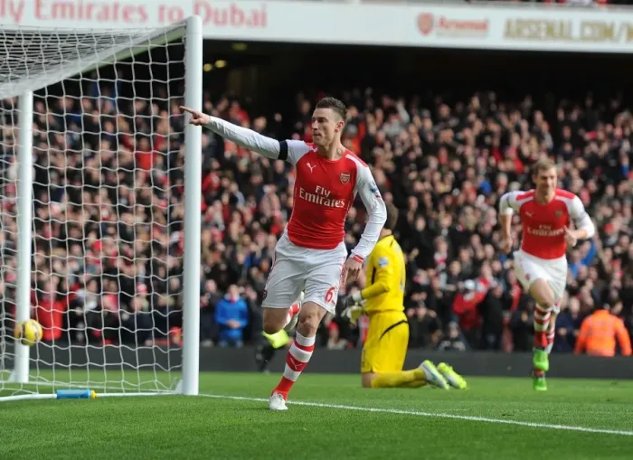 Framed Print : Koscielny's Game-Winning Goal: Arsenal Overpowers Stoke City in Premier League 2014-15