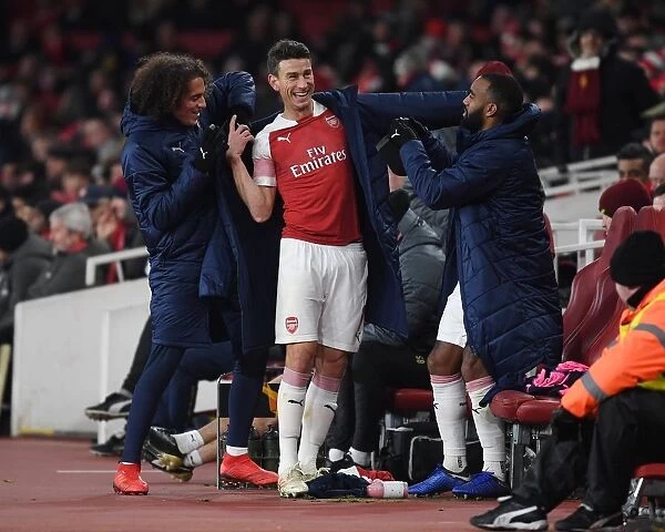 Koscielny's Playful Farewell: A Light-Hearted Moment with Guendouzi and Lacazette during Arsenal's Substitution vs Qarabag