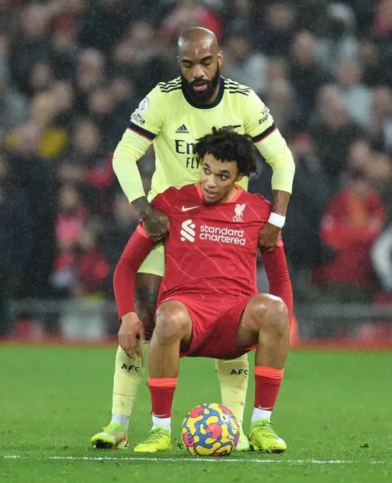 Framed Print : Lacazette Consoles Trent Alexander-Arnold: A Moment of Sportsmanship in the Premier League Clash Between Liverpool and Arsenal (November 2021)