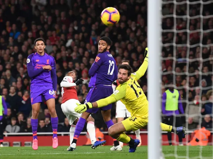 Framed Print : Lacazette Stuns Liverpool: The Moment Arsenal's Star Forward Scores Past Alisson and Co