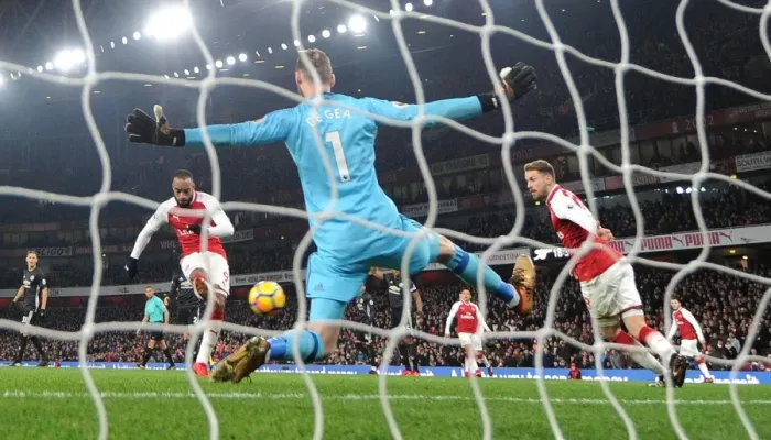 Framed Print : Lacazette Stuns Man Utd: Premier League Showdown - Arsenal's Star Forward Scores Past De Gea