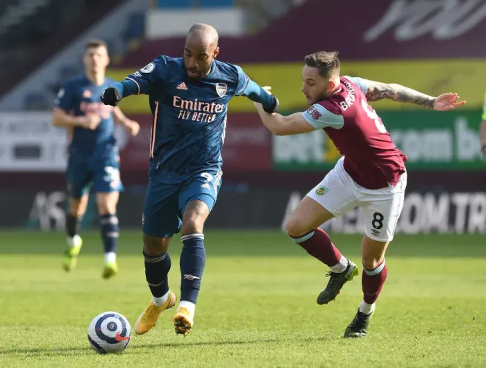 Framed Print : Lacazette vs Brownhill: Empty Turf Moor Clash - Premier League 2020-21: A Battle Between Arsenal's Alexandre Lacazette and Burnley's Josh Brownhill in an Emptied Stadium Framed Print : Lacazette vs Brownhill: Empty Turf Moor Clash - Premier League 2020-21: A Battle Between Arsenal's Alexandre Lacazette and Burnley's Josh Brownhill in an Emptied Stadium