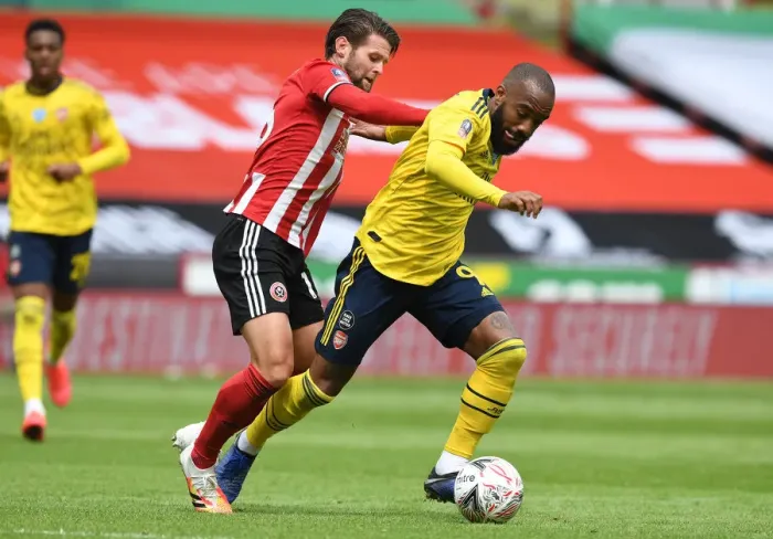 Framed Print : Lacazette vs. Egan: A FA Cup Quarterfinal Battle at Bramall Lane - Arsenal vs. Sheffield United Framed Print : Lacazette vs. Egan: A FA Cup Quarterfinal Battle at Bramall Lane - Arsenal vs. Sheffield United