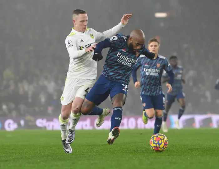 Framed Print : Lacazette vs. Forshaw: A Football Rivalry Ignites in Leeds United vs. Arsenal Clash