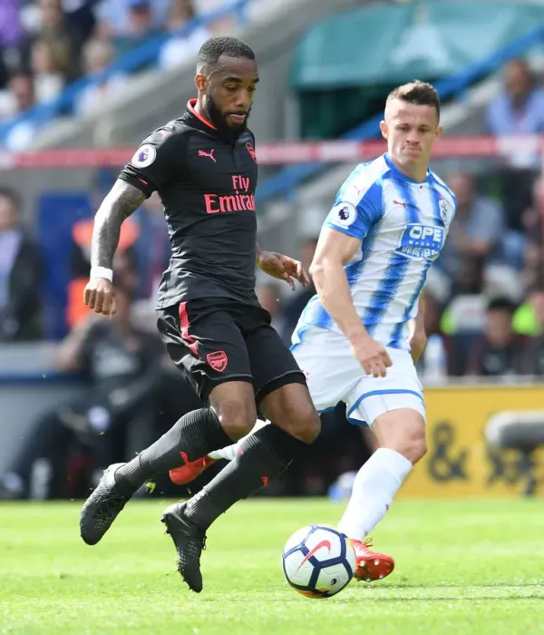 Framed Print : Lacazette vs. Hogg: Intense Battle in Huddersfield Town vs. Arsenal Premier League Clash