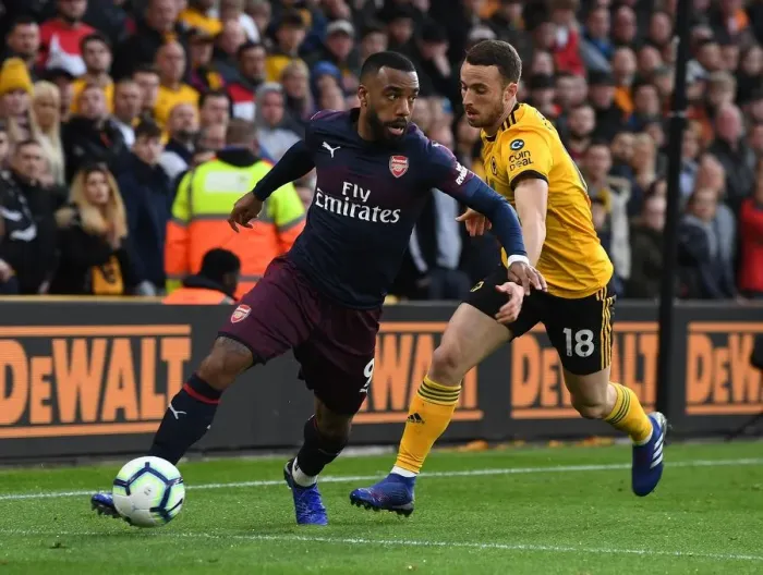 Framed Print : Lacazette vs. Jota: Intense Battle at Molineux - Wolverhampton Wanderers vs. Arsenal FC, Premier League 2018-19