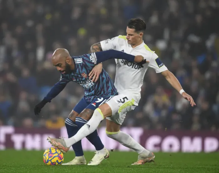 Framed Print : Lacazette vs. Koch: A Premier League Battle - Leeds United vs. Arsenal