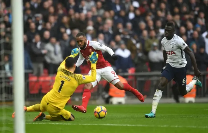 Framed Print : Lacazette vs. Lloris: Intense Moment at the Wembley Stadium - Premier League Showdown