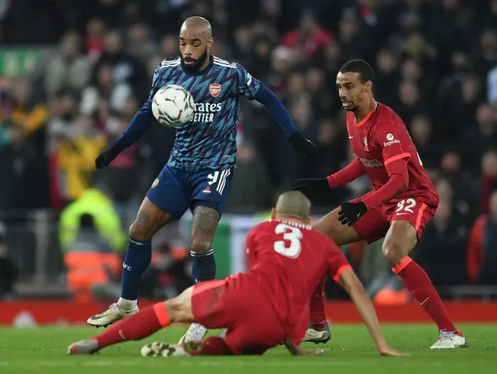 Framed Print : Lacazette vs Matip: Intense Battle in Carabao Cup Semi-Final First Leg between Liverpool and Arsenal