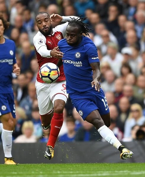 Lacazette vs. Moses: A Premier League Battle - Arsenal's Star Forward Clashes with Chelsea's Defender (2017-18)