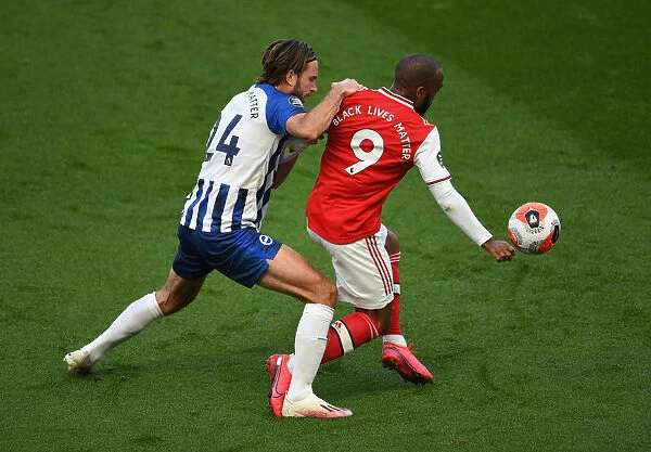 Lacazette vs. Propper: A Premier League Battle - Arsenal's Star Forward Clashes with Brighton's Midfielder