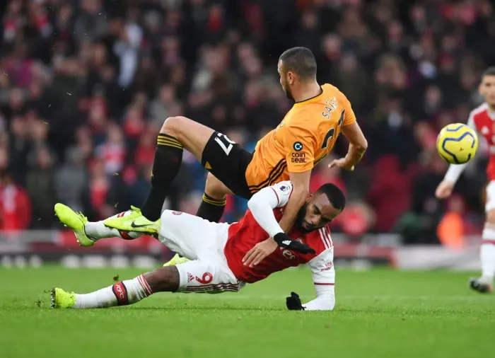 Framed Print : Lacazette vs. Saiss: A Premier League Battle at the Emirates