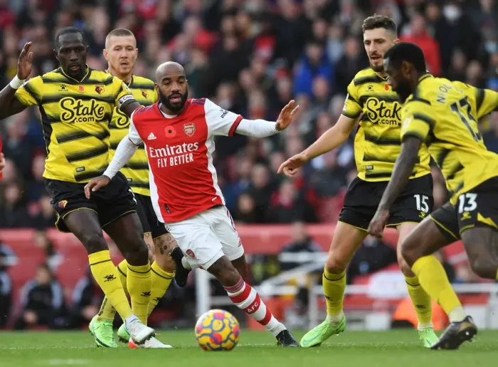 Framed Print : Lacazette vs. Sissoko: A Premier League Showdown at Emirates Stadium - Arsenal vs. Watford