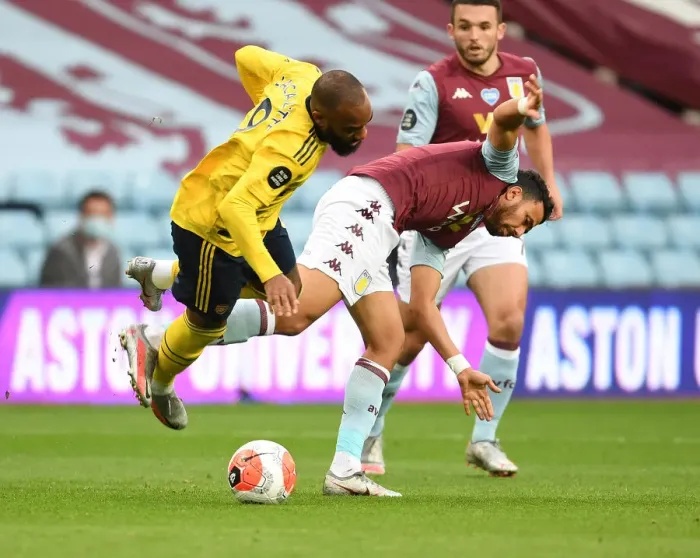 Framed Print : Lacazette vs. Trezeguet: A Premier League Clash at Villa Park