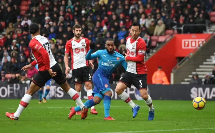Framed Print : Lacazette vs Yoshida: Intense Moment at Southampton-Arsenal Premier League Clash Framed Print : Lacazette vs Yoshida: Intense Moment at Southampton-Arsenal Premier League Clash