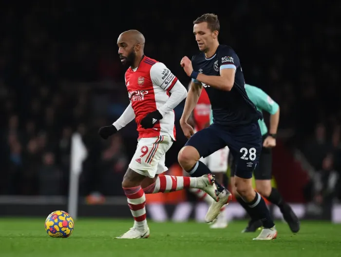 Framed Print : Lacazette's Slick Moves: Outsmarting Soucek in Arsenal's Premier League Victory Framed Print : Lacazette's Slick Moves: Outsmarting Soucek in Arsenal's Premier League Victory