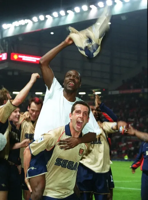 Framed Print : Lauren and Edu celebrate the Arsenal Championship victory after the match Framed Print : Lauren and Edu celebrate the Arsenal Championship victory after the match