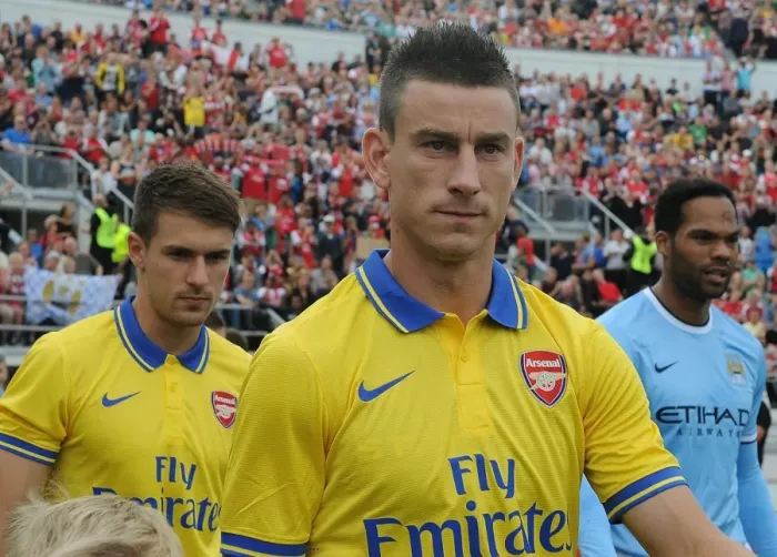 Framed Print : Laurent Koscielny: Arsenal's Focused Defender Ahead of Arsenal vs Manchester City Pre-Season Clash (2013)