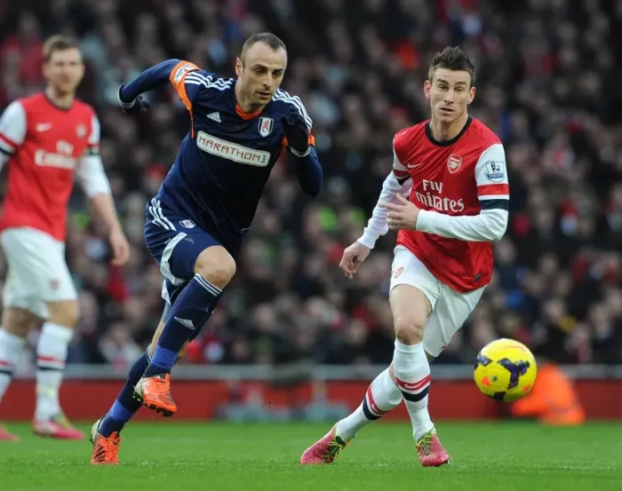 Framed Print : Laurent Koscielny (Arsenal) Dimitar Berbatov (Fulham). Arsenal 2: 0 Fulham. Barclays Premier League