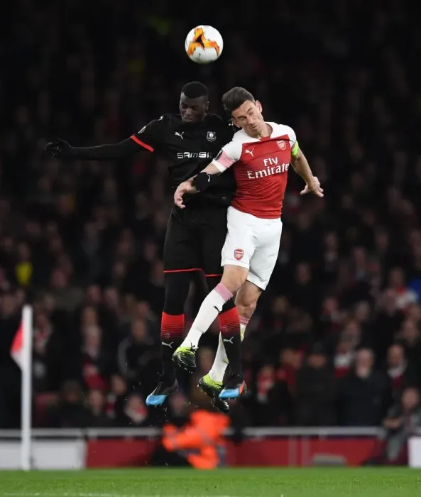 Framed Print : Laurent Koscielny (Arsenal) M Baye Niang (Rennes) Framed Print : Laurent Koscielny (Arsenal) M Baye Niang (Rennes)