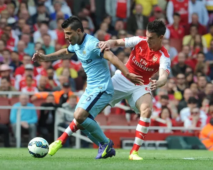Framed Print : Laurent Koscielny (Arsenal) Sergio Aguero (Man City). Arsenal 2: 2 Manchester City