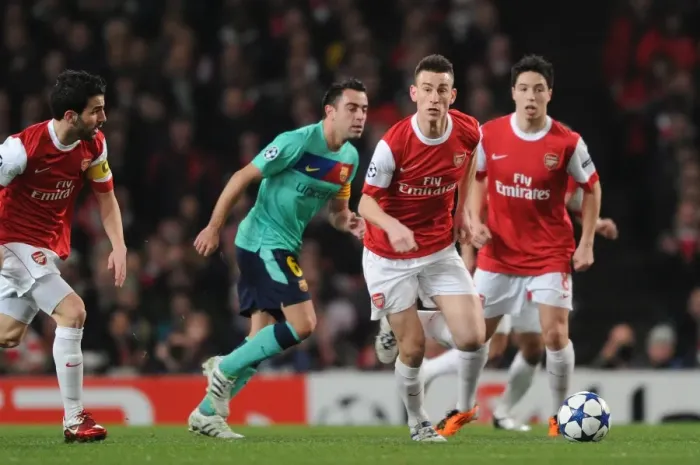 Framed Print : Laurent Koscielny (Arsenal) Xavi (Barcelona). Arsenal 2: 1 Barcelona, UEFA Champions League
