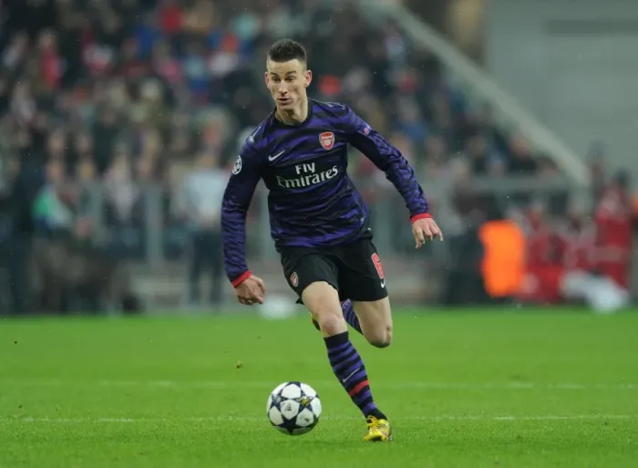 Framed Print : Laurent Koscielny: Arsenal's Fortitude in the Face of Bayern Munchen in the UEFA Champions League Framed Print : Laurent Koscielny: Arsenal's Fortitude in the Face of Bayern Munchen in the UEFA Champions League