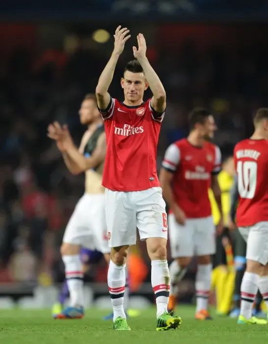 Framed Print : Laurent Koscielny: Arsenal's Steadfast Defender Against Napoli in the Champions League (2013) Framed Print : Laurent Koscielny: Arsenal's Steadfast Defender Against Napoli in the Champions League (2013)