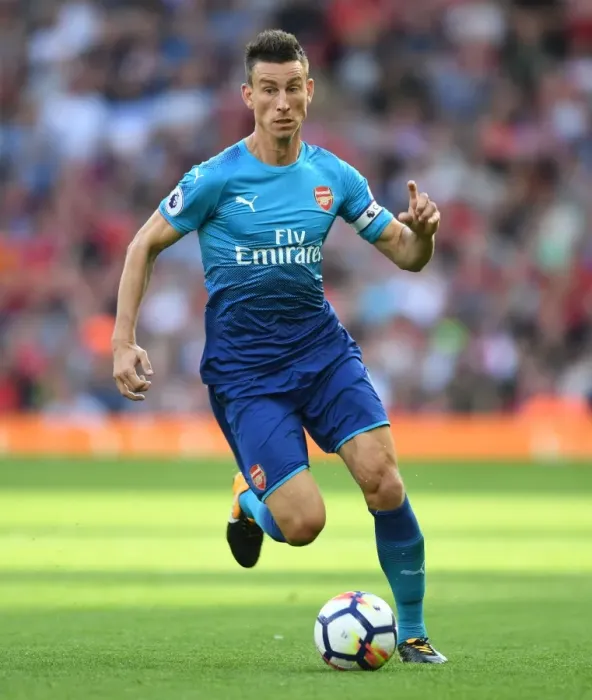 Framed Print : Laurent Koscielny Faces Off at Anfield: Liverpool vs. Arsenal, 2017-18 Premier League