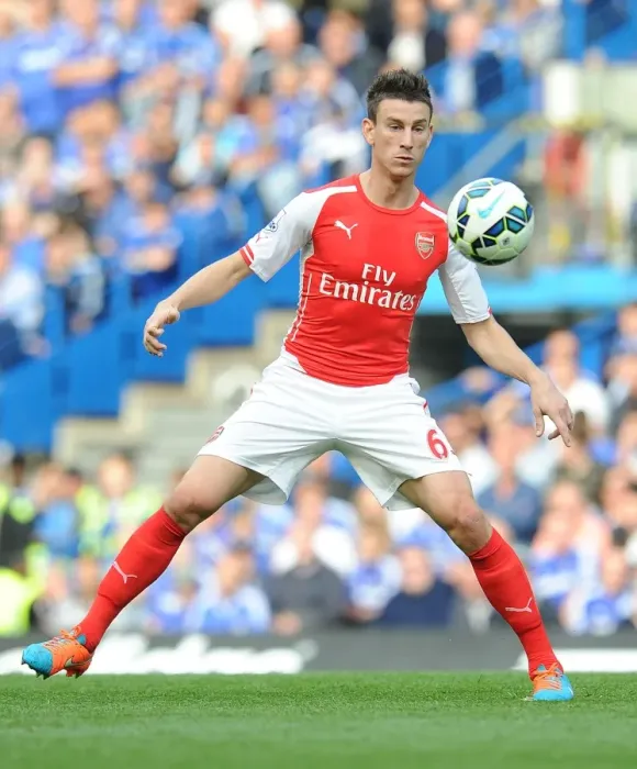 Framed Print : Laurent Koscielny Faces Off Against Chelsea in the 2014-15 Premier League Clash