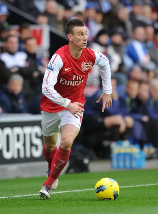 Framed Print : Laurent Koscielny Focused: Wigan Athletic vs Arsenal, Premier League 2011-12