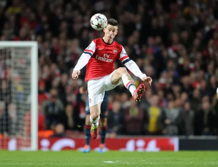 Framed Print : Laurent Koscielny Focuses in Arsenal's Champions League Battle against Bayern Munich