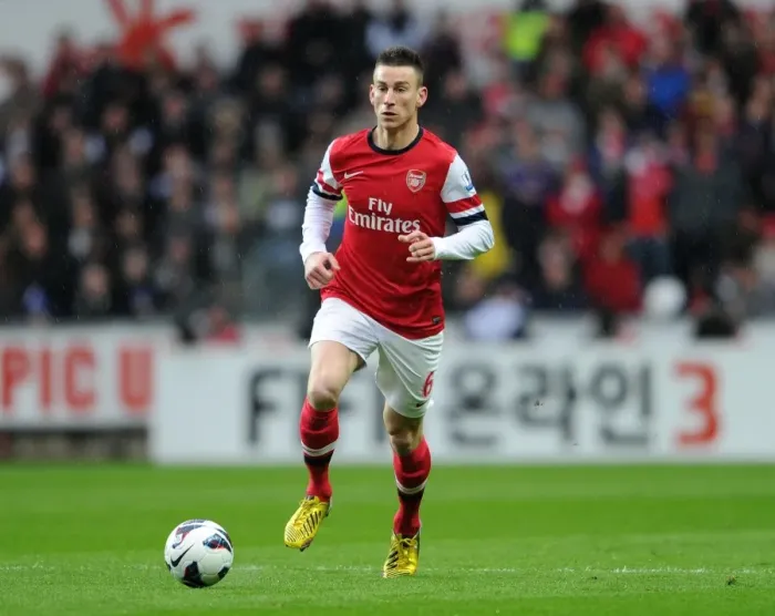 Framed Print : Laurent Koscielny Focuses in Swansea City vs Arsenal Clash (2012-13)