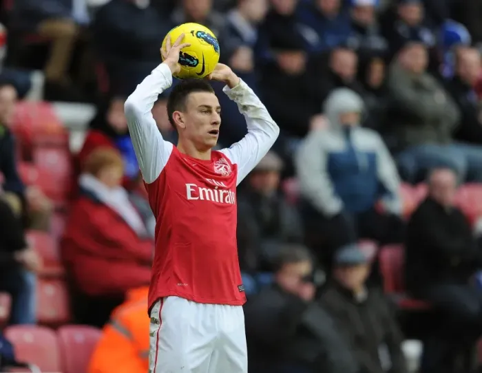 Framed Print : Laurent Koscielny Focuses in Wigan Athletic vs Arsenal Premier League Clash (2011-12)
