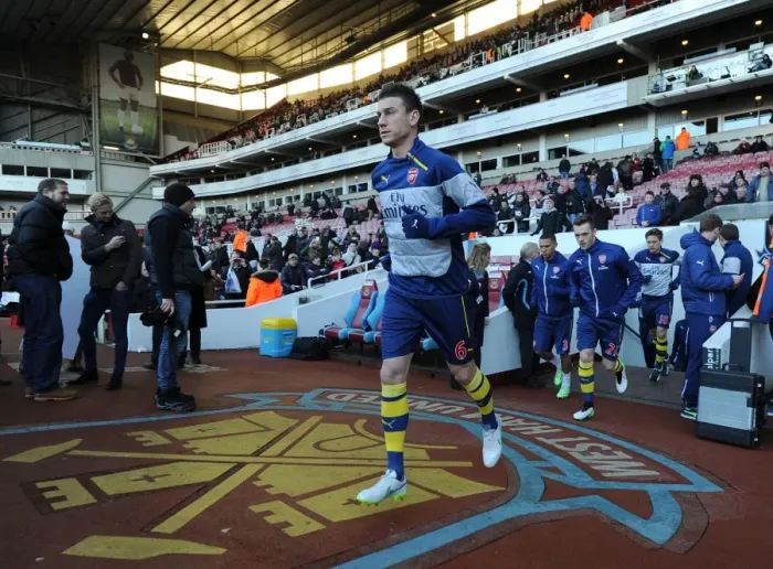Framed Print : Laurent Koscielny Gearing Up: Arsenal vs. West Ham United, Premier League (2014-15)
